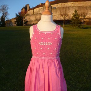 Traditional pink dress with daisy embroideries